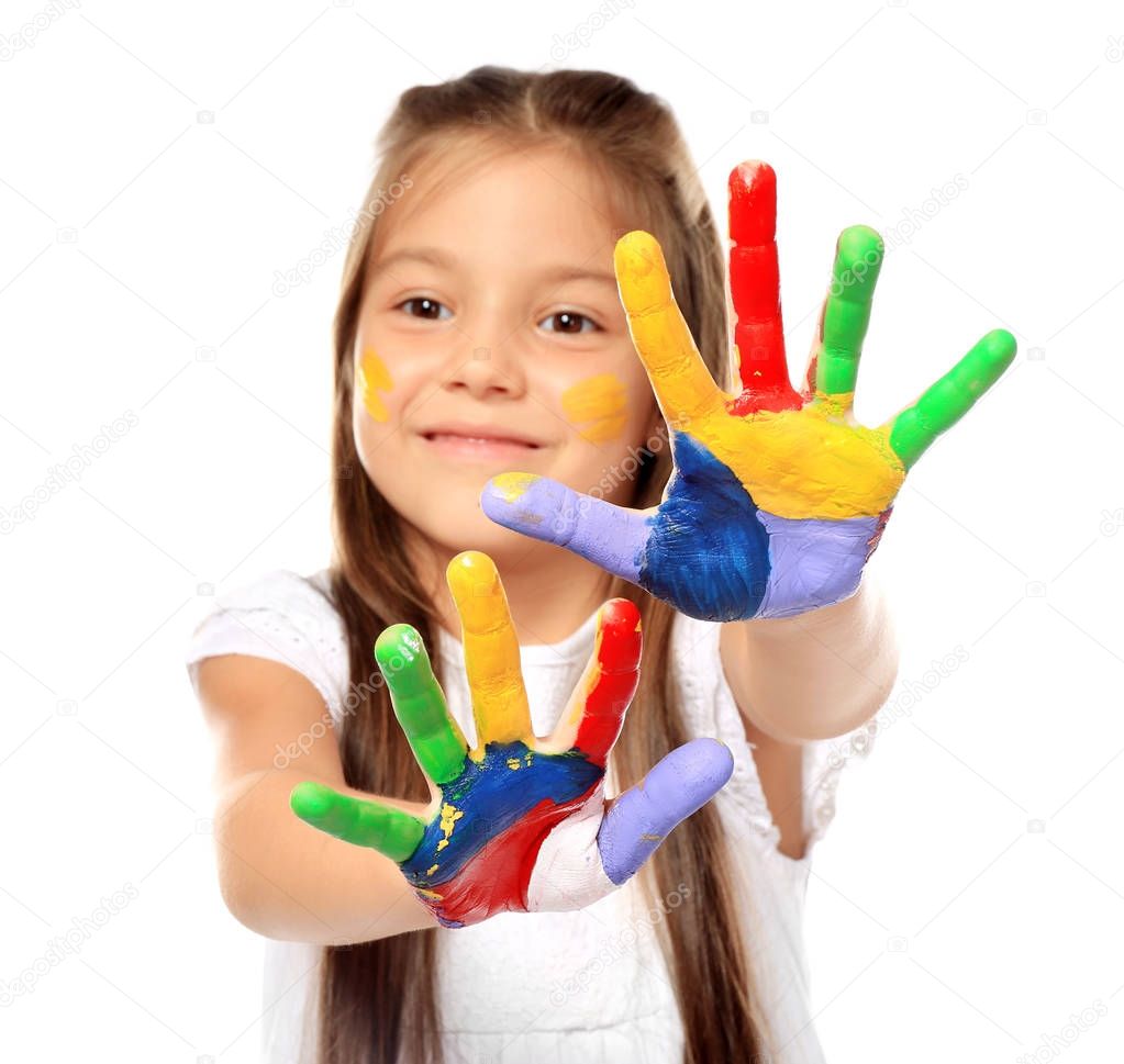 Little cute girl showing painted hands on white background