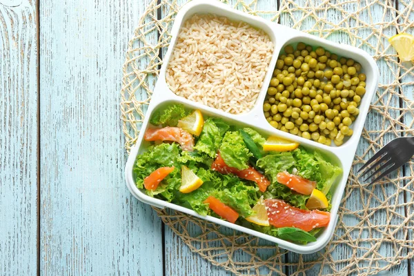 Lunch box with delicious salmon salad