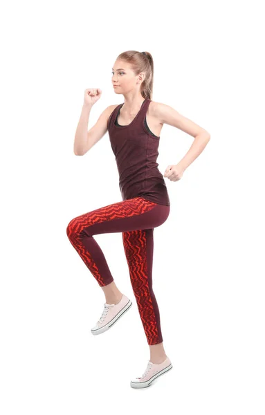 Joven mujer deportiva corriendo sobre fondo blanco — Foto de Stock