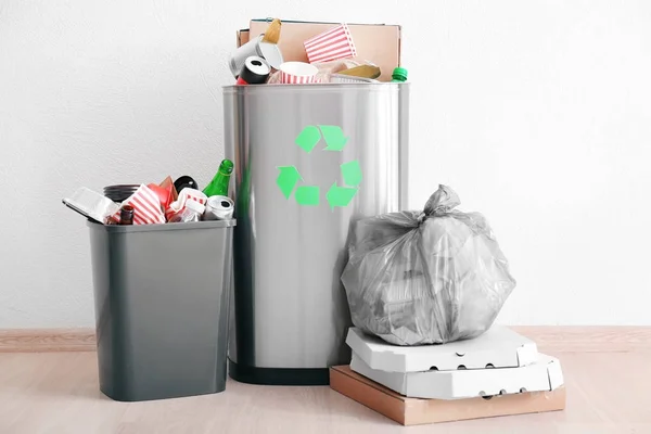 Litter bins and bag with garbage indoors — Stock Photo, Image