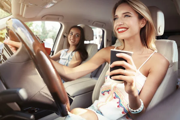 Beautiful young women in car — Stock Photo, Image