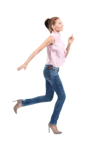 Mujer joven corriendo sobre fondo blanco — Foto de Stock