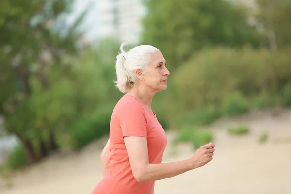 Senior woman exercising outdoors