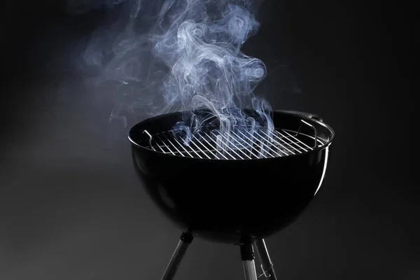 Barbecue grill on dark background — Stock Photo, Image
