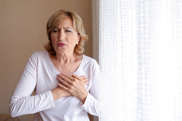 Woman having heart attack at home