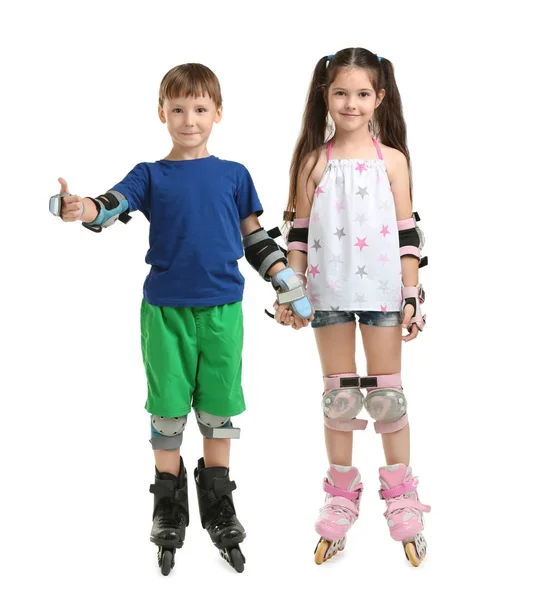 Cute children on roller skates against white background — Stock Photo, Image