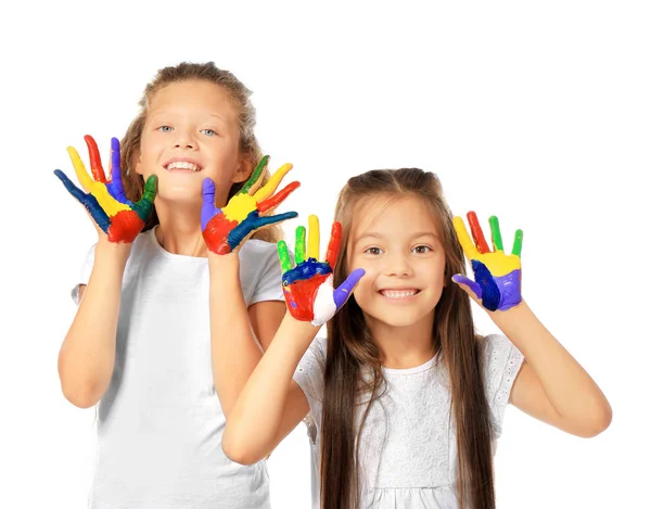 Kleine schattige meisjes tonen geschilderd handen op witte achtergrond — Stockfoto