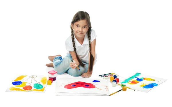 Little cute girl painting picture against white background — Stock Photo, Image