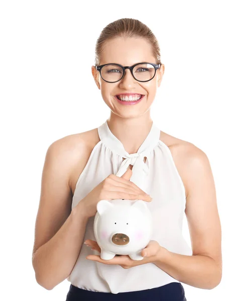 Fiatal nő, malacka bank, fehér háttér — Stock Fotó