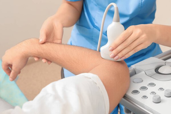 Doctor conducting ultrasound examination