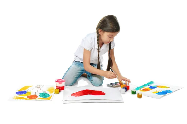 Little cute girl painting picture against white background — Stock Photo, Image