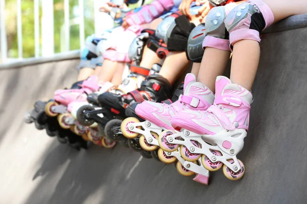 Legs of children on rollers — Stock Photo, Image