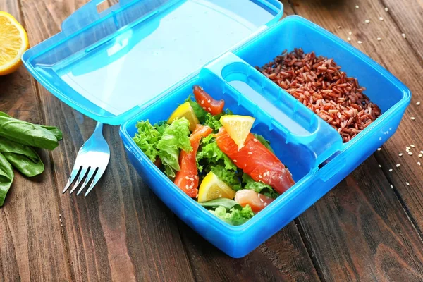 Lunch box with delicious salmon salad