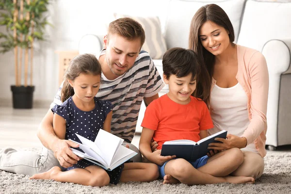 Happy family reading books at home