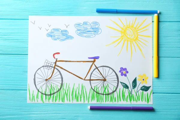 Child\'s drawing of bicycle on blue background