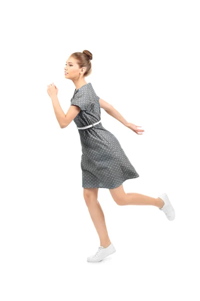 白い背景の上を走っている若い女性 — ストック写真