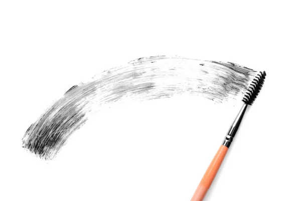 Pinsel mit Wimperntusche auf weißem Hintergrund — Stockfoto