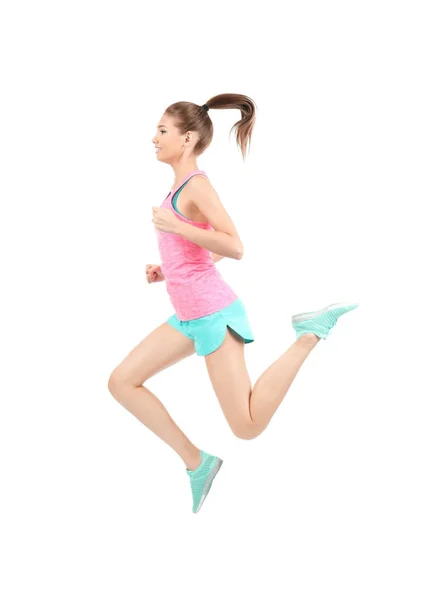 Junge sportliche Frau springt auf weißem Hintergrund — Stockfoto