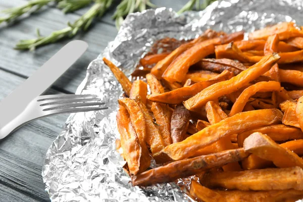 Sweet potato sticks on foil — Stock Photo, Image