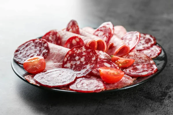 Plate with delicious sliced sausages — Stock Photo, Image