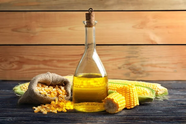 Composition with corn oil, cobs and kernels