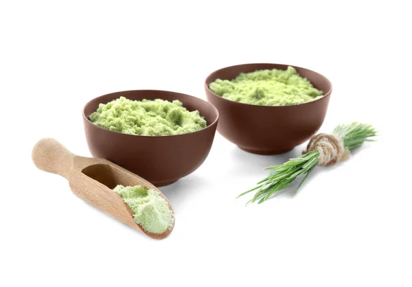 Bowls and scoop of wheat grass powder with sprouts — Stock Photo, Image