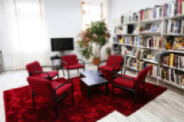 Cozy reading room in library, blurred background — Stock Photo, Image