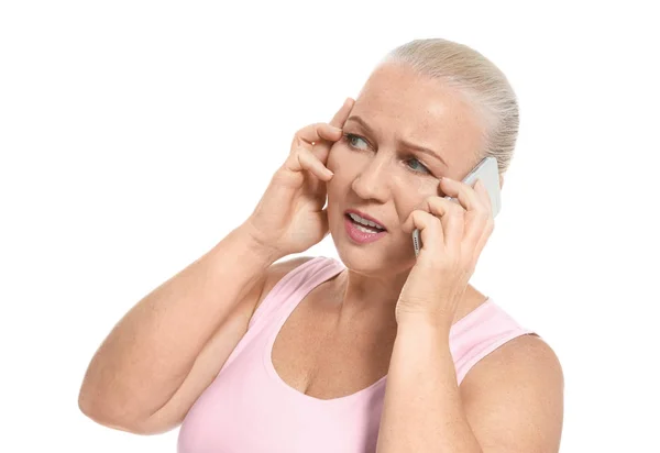 Senior woman speaking on cell phone, isolated on white — Stock Photo, Image