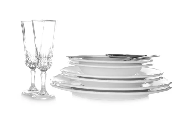 Glasses, cutlery and ceramic dishware on white background — Stock Photo, Image