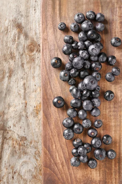 Fresh acai berries on wooden background — Stock Photo, Image