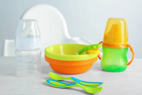 Bright baby dishware on table — Stock Photo, Image