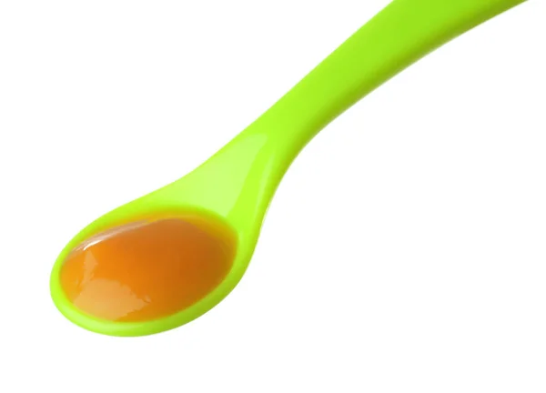 Cucchiaio di plastica con alimenti per bambini — Foto Stock