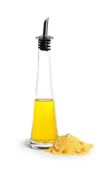 Glass bottle with corn oil and pile of flour — Stock Photo, Image