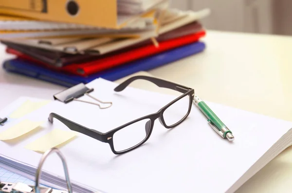 Documents and glasses on table in archive — Stock Photo, Image