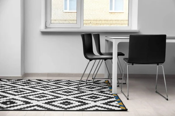Black and white carpet on floor indoors — Stock Photo, Image