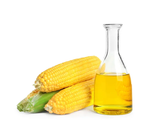 Glass bottle with corn oil and ripe cobs — Stock Photo, Image