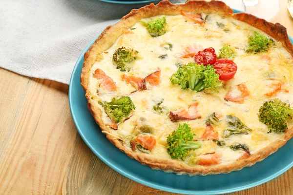 Tasty salmon quiche on plate — Stock Photo, Image