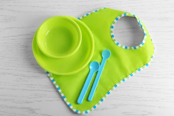 Set with bright baby dishware on table — Stock Photo, Image