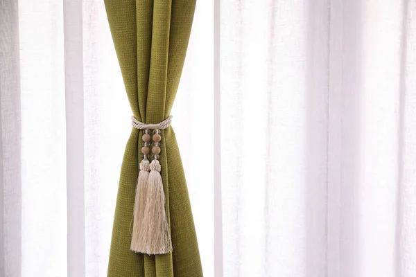 Beautiful curtains with tieback indoors, close seup — стоковое фото