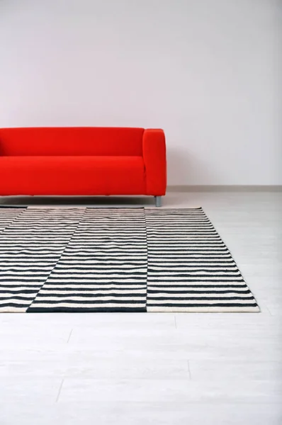 Black and white striped carpet on floor in living room Stock Picture