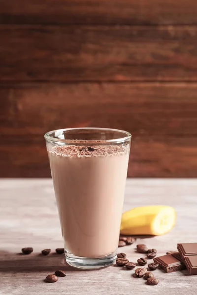 Glass with chocolate protein shake — Stock Photo, Image