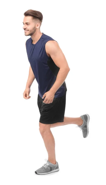 Junger Mann in Sportkleidung läuft — Stockfoto