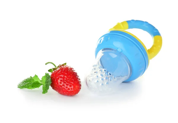 Baby's nibbler and ripe strawberry — Stock Photo, Image