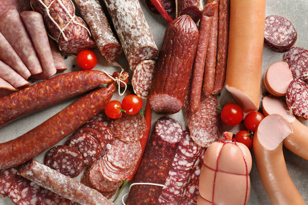 Assortment of delicious sausages on table