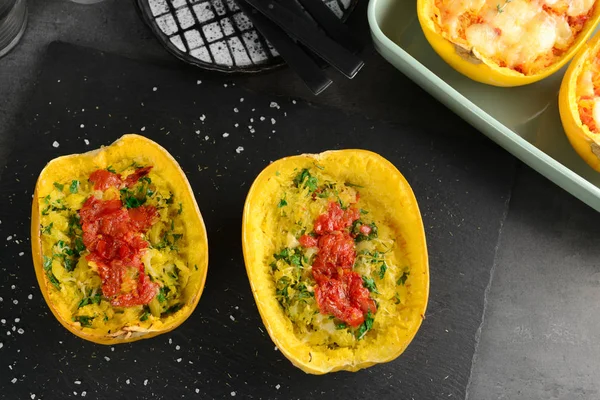 Halves of stuffed spaghetti squash