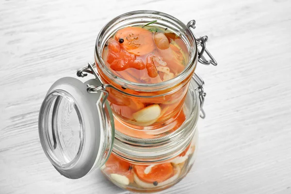 Jars with delicious marinated salmon — Stock Photo, Image