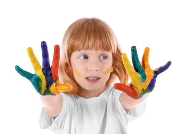 Schattig meisje met paint op gezicht en handen tegen de witte achtergrond — Stockfoto