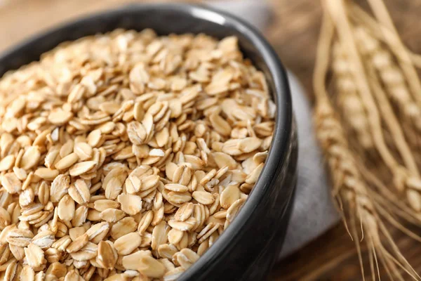 Bowl with oatmeal flakes — Stock Photo, Image