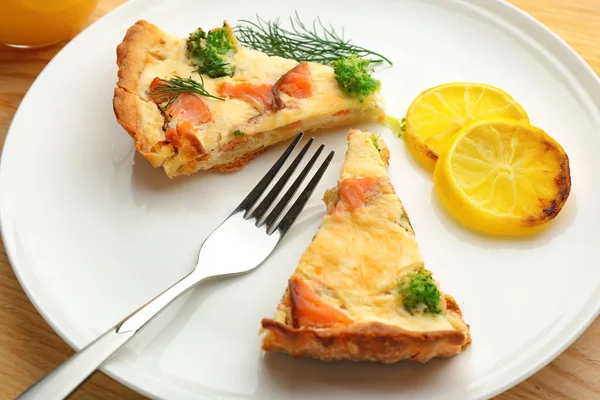 Pieces of salmon quiche pie on plate, closeup — Stock Photo, Image