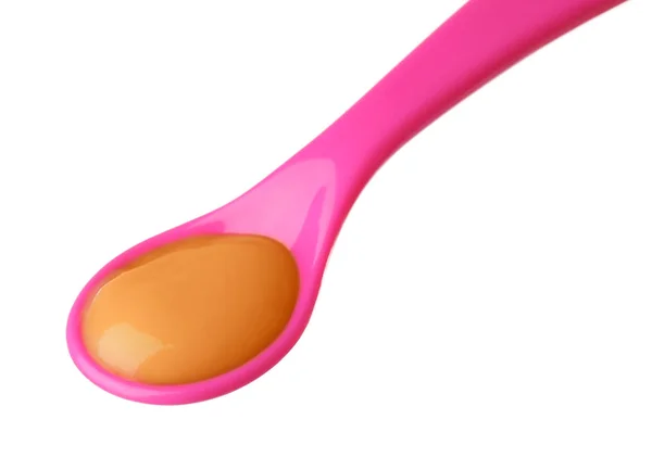 Plastic spoon with baby food — Stock Photo, Image